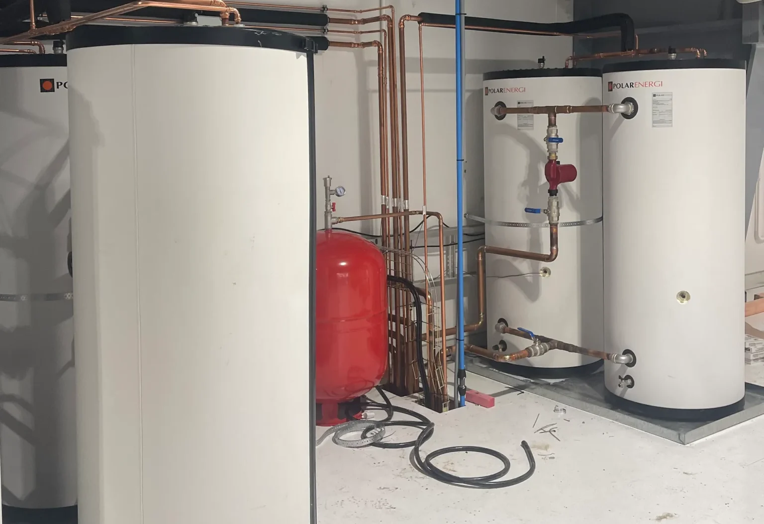 two white hot water cylinder and heating pipes system installed by PolarEnergi NZ