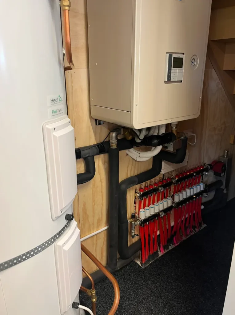 Hot water cylinder and a boiler installed in a residential property by PolarEnergi NZ