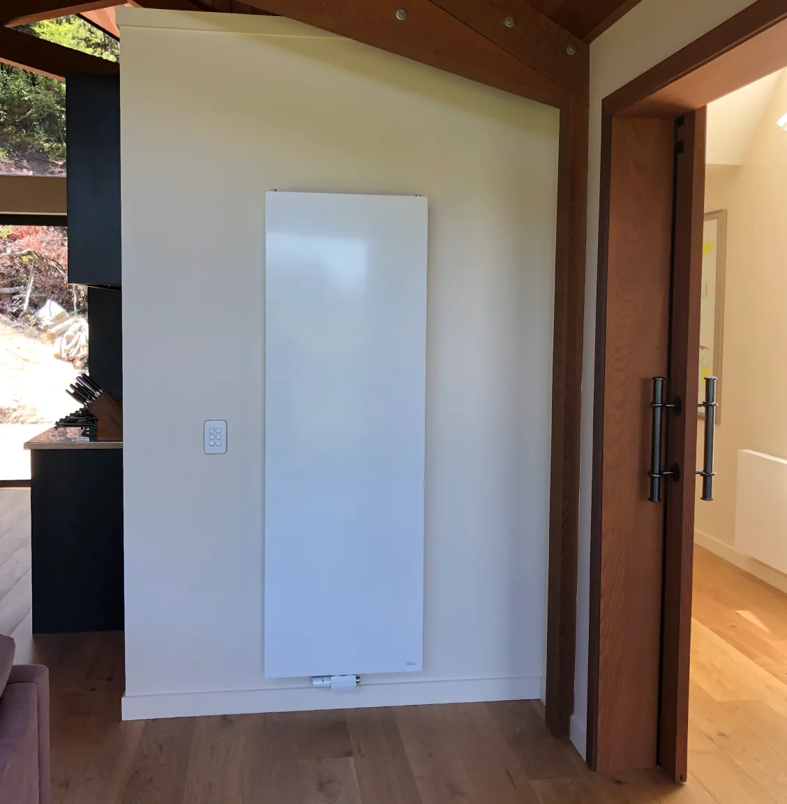 white vertical aligned radiator installed by PolarEnergi NZ