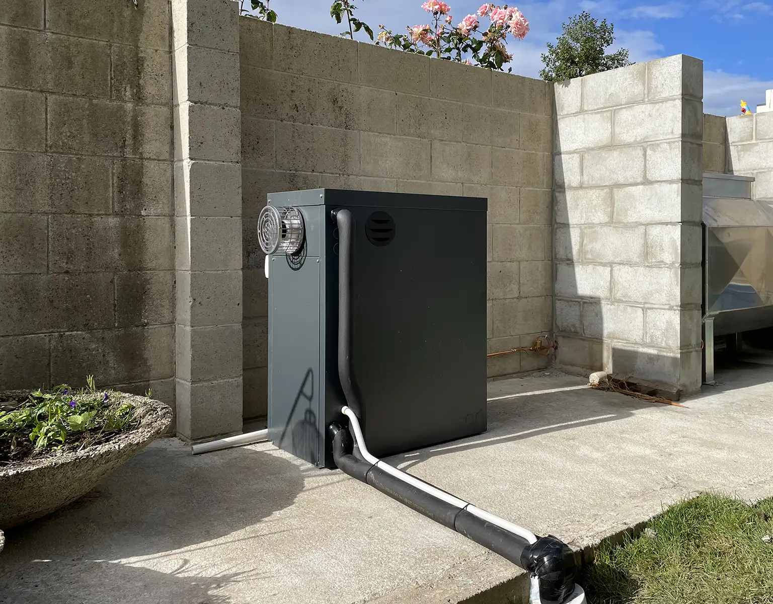 black colour box type boiler installed at a residential property in New Zealand by PolarEnergi NZ